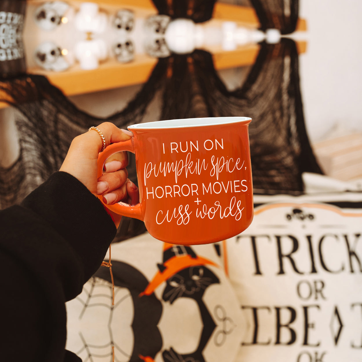 Pumpkin + Horror Mug featuring vibrant orange color and white lettering, perfect for fall and horror movie lovers.