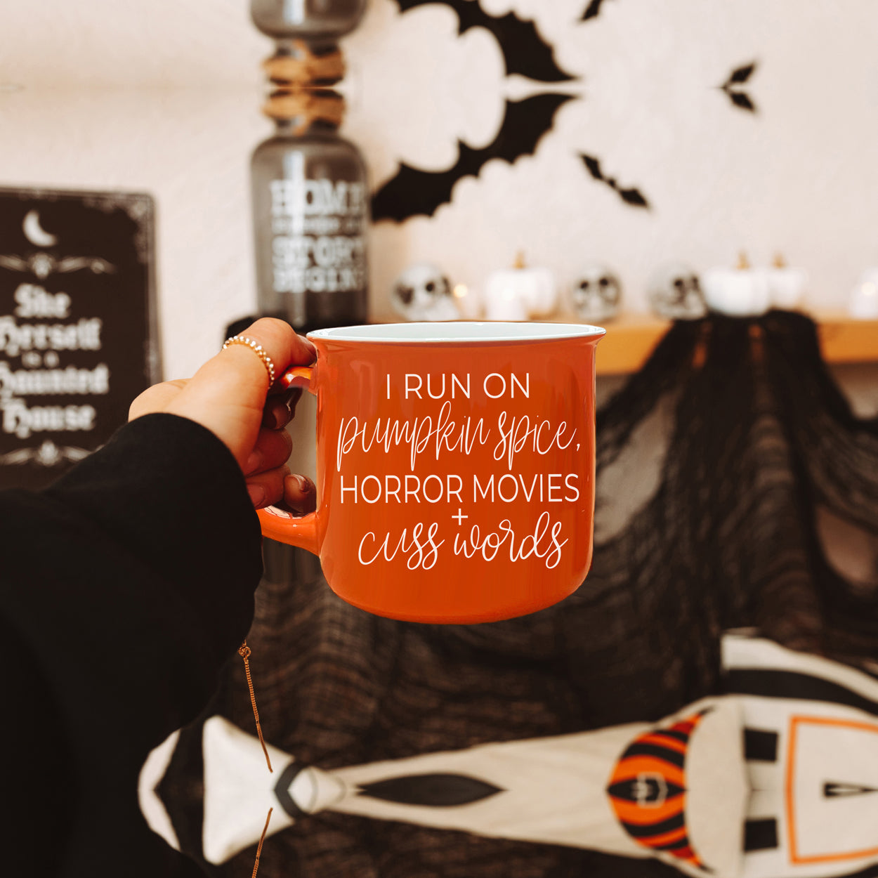 Pumpkin + Horror Mug featuring vibrant orange color and white lettering, perfect for fall and horror movie lovers.