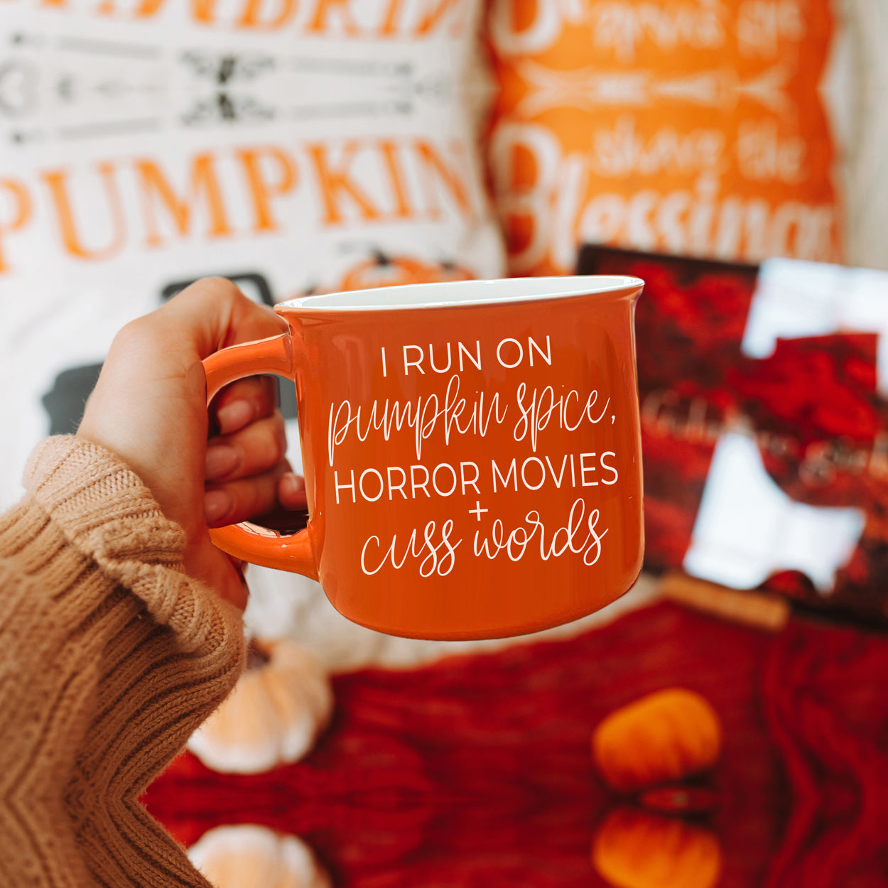 Pumpkin + Horror Mug featuring vibrant orange color and white lettering, perfect for fall and horror movie lovers.