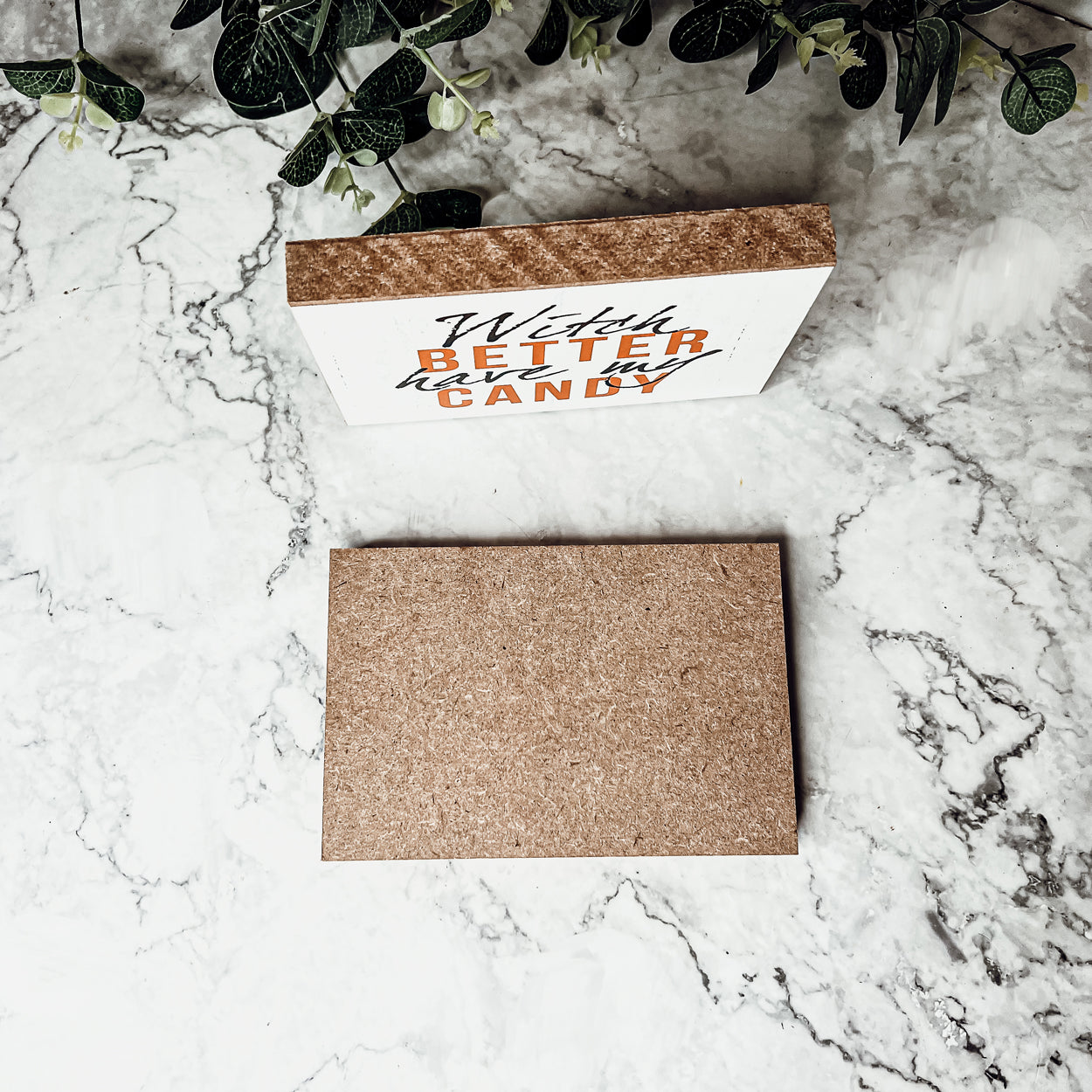 A rustic wooden sign reading 'Witch Better Have My Candy' in black and orange lettering, perfect for Halloween decor.