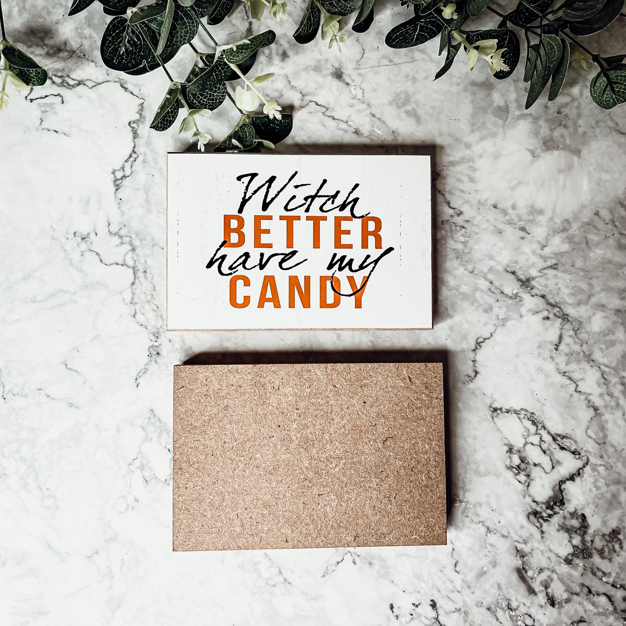 A rustic wooden sign reading 'Witch Better Have My Candy' in black and orange lettering, perfect for Halloween decor.