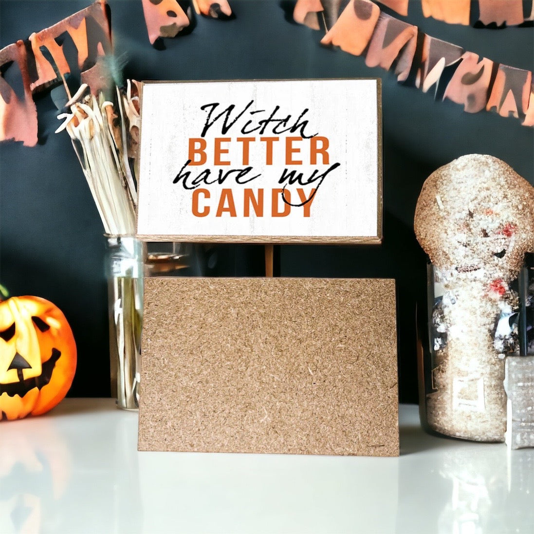 A rustic wooden sign reading 'Witch Better Have My Candy' in black and orange lettering, perfect for Halloween decor.