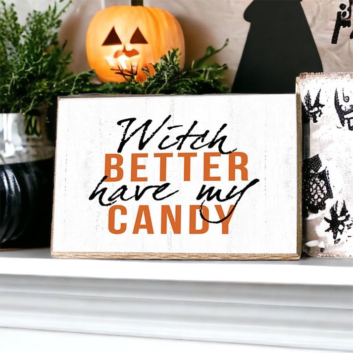 A rustic wooden sign reading 'Witch Better Have My Candy' in black and orange lettering, perfect for Halloween decor.
