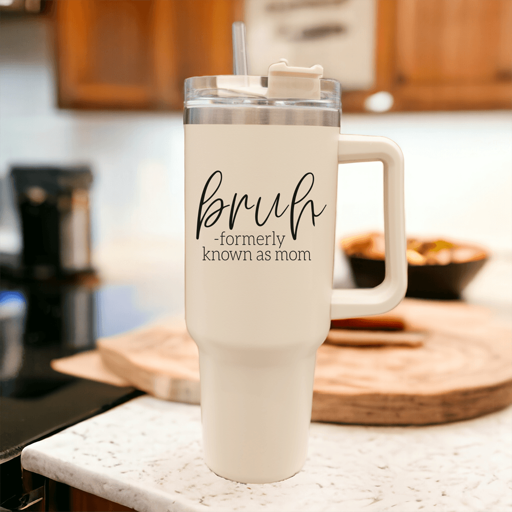 Bruh 40oz tumbler with cream exterior and black graphic design, featuring a handle and a versatile 3-in-1 lid.