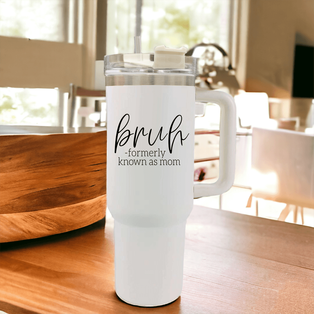 Bruh 40oz tumbler with cream exterior and black graphic design, featuring a handle and a versatile 3-in-1 lid.