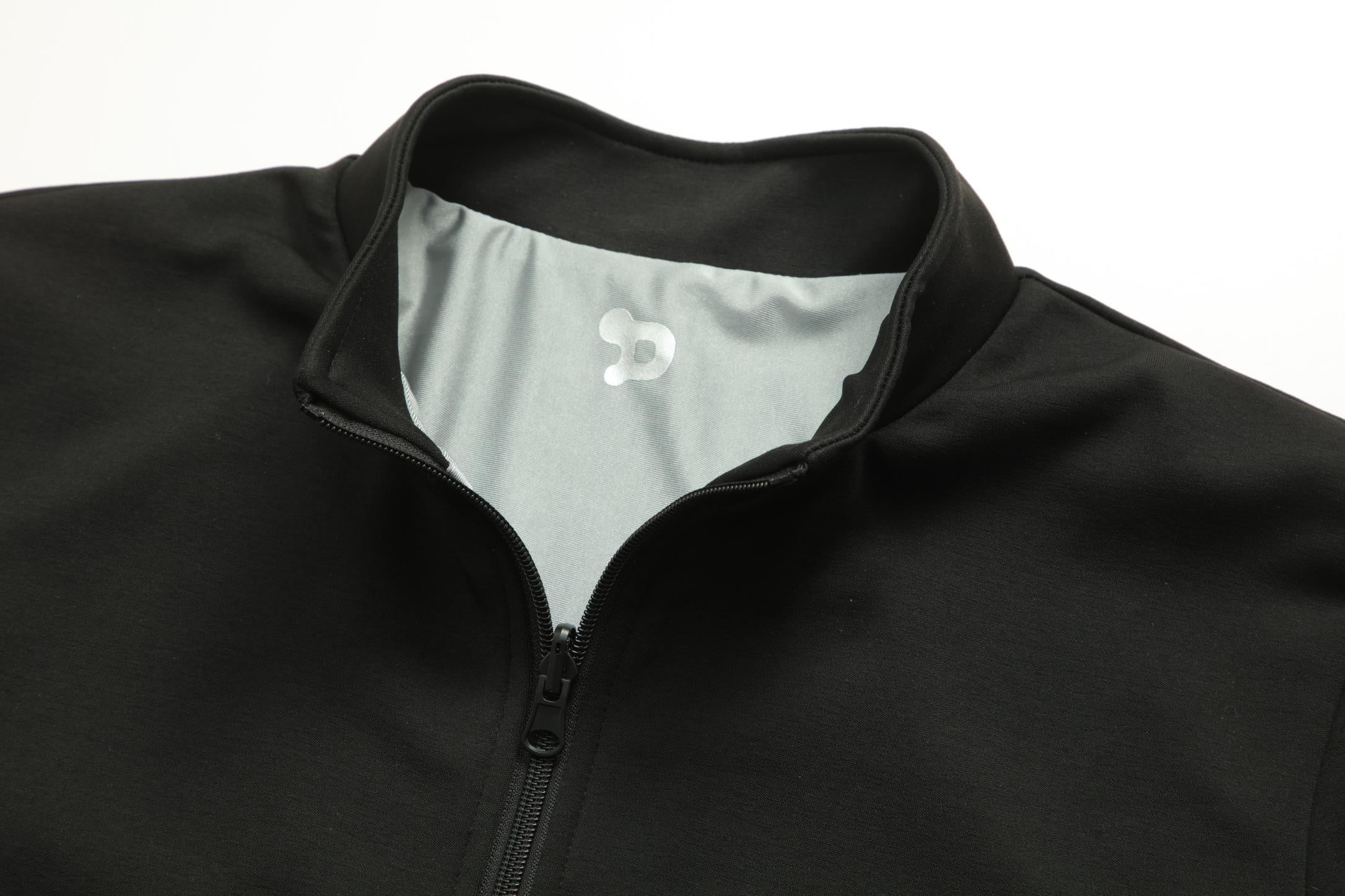 Women's CoreD Pro Reversible Jacket showcasing deep rich colors and luxurious silver embellishments, designed for style and functionality.