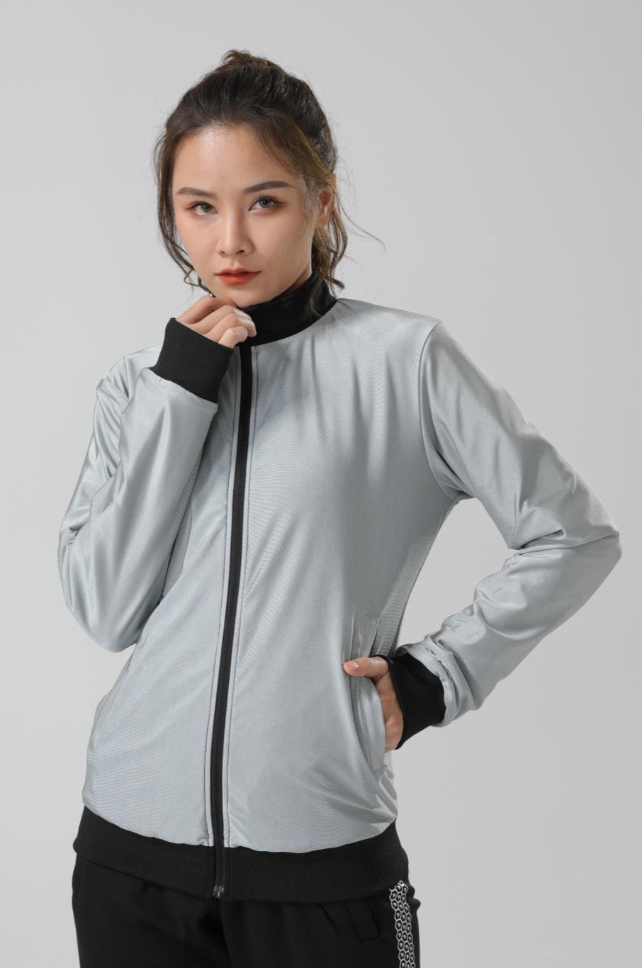 Women's CoreD Pro Reversible Jacket showcasing deep rich colors and luxurious silver embellishments, designed for style and functionality.