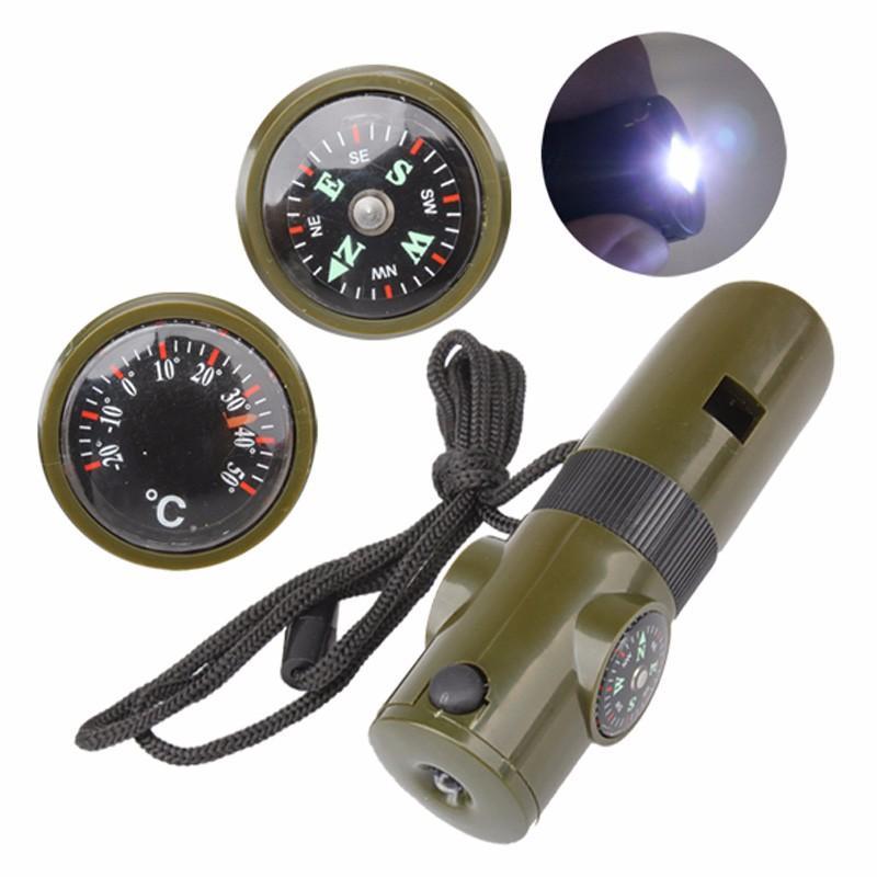 Multi-function Seven-in-one Whistle Survival Compass featuring a whistle, flashlight, magnifier, thermometer, mirror, sealed compartment, and compass in a compact design.