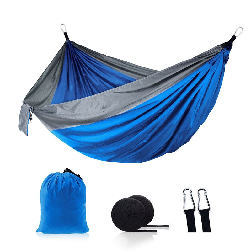 A vibrant outdoor camping hammock swing set in purple, grey, and blue, showcasing its foldable design and included accessories.
