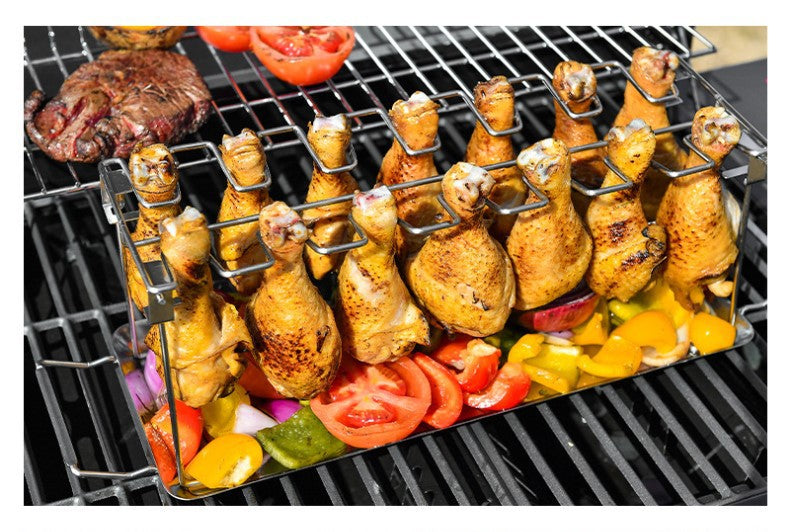 Portable Grilling Basket Mesh Clip with 14 slots, made of stainless steel, featuring a folding stand and drip tray for grilling chicken legs and vegetables.