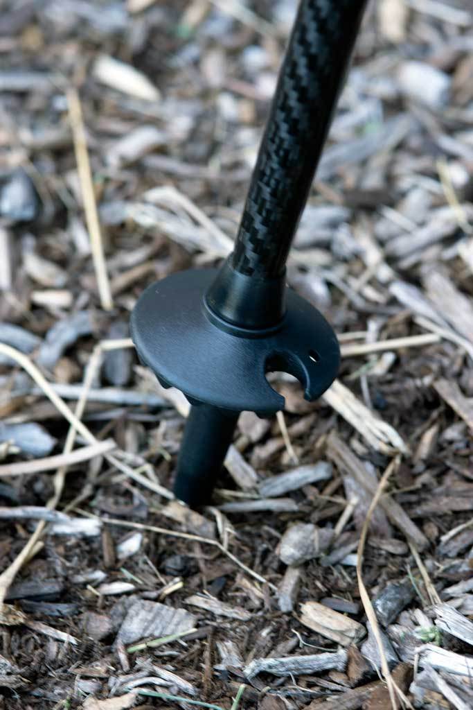 A set of four trekking pole baskets, 50 mm in diameter, designed for mud and snow with serrated edges for enhanced grip.