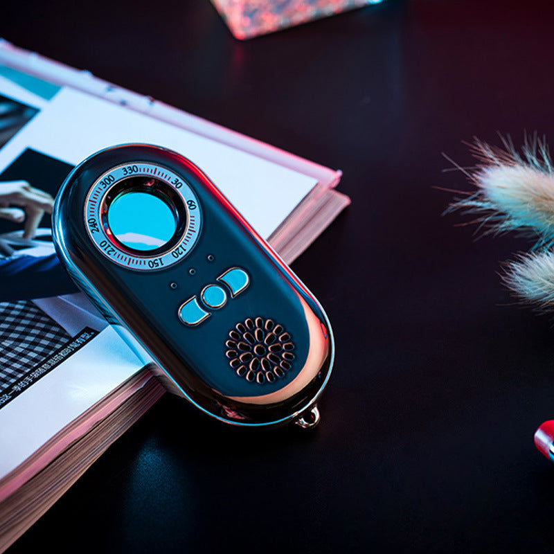 Hidden Bug Finder Anti-Theft Device Alarm in black and rose gold, featuring an infrared detector and LED flashlight.