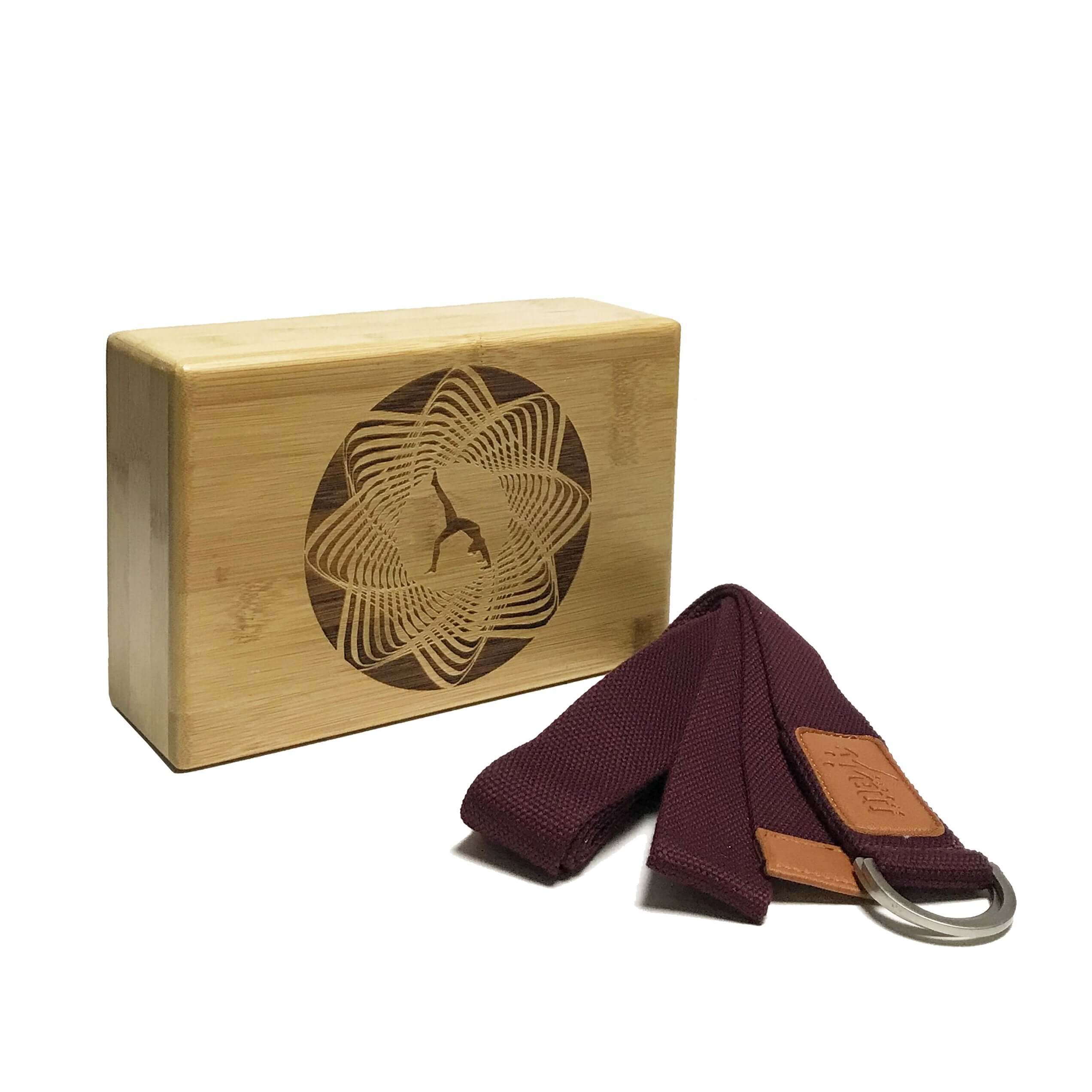Laser engraved bamboo yoga block and adjustable strap combo with circle design, perfect for enhancing yoga practice and flexibility.