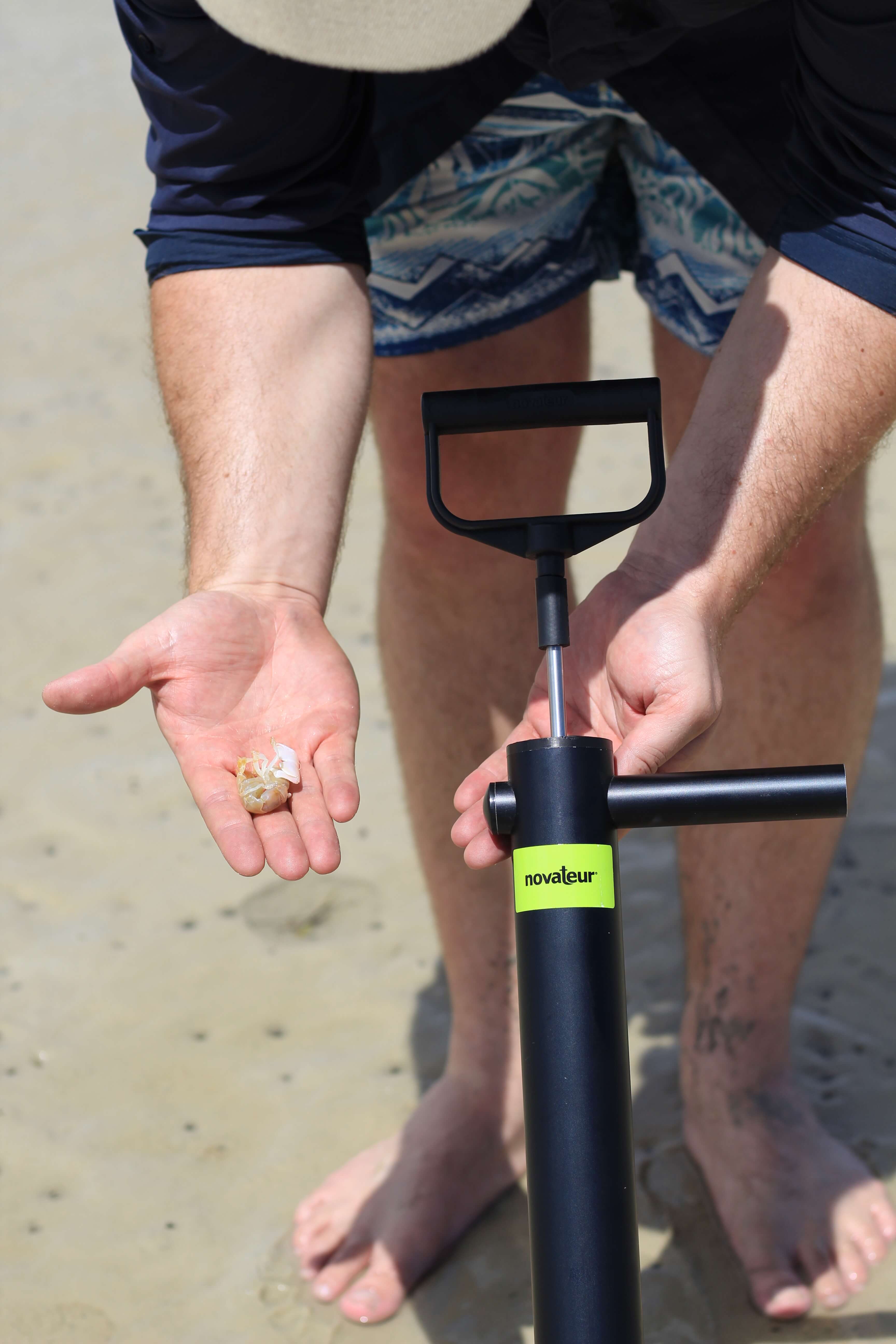 Novateur Ghost Shrimp Pump made of black aluminum, featuring a comfortable handle and stainless steel components, designed for efficient shrimp pumping.