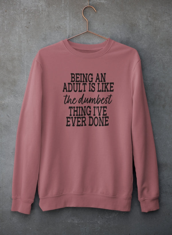 Cozy sweatshirt featuring the phrase 'Adulting Is The Dumbest Thing I've Ever Done' in a stylish design, perfect for casual wear.