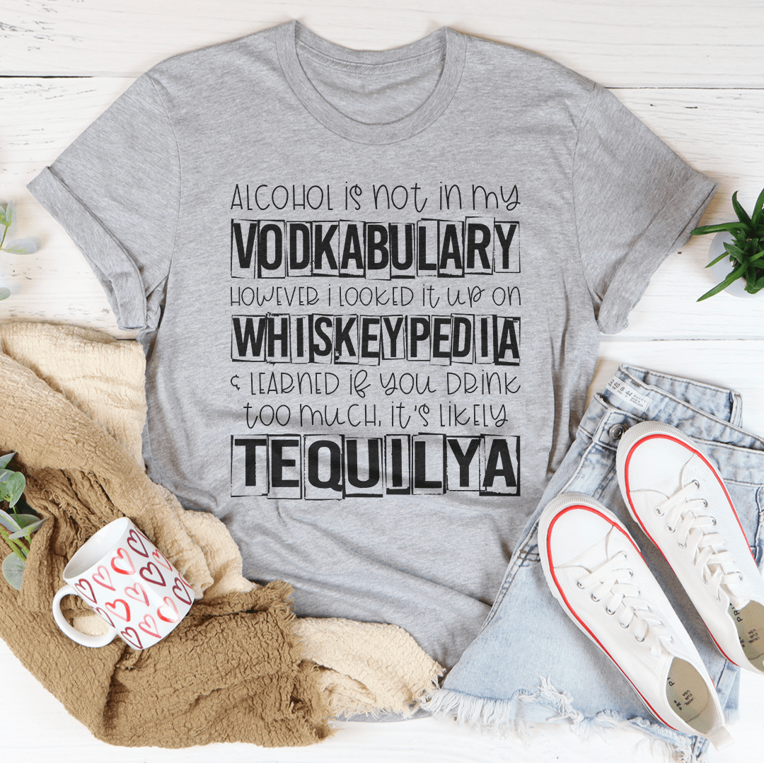 A humorous t-shirt featuring the phrase 'Alcohol Is Not In My Vodkabulary' printed on soft, durable cotton fabric.