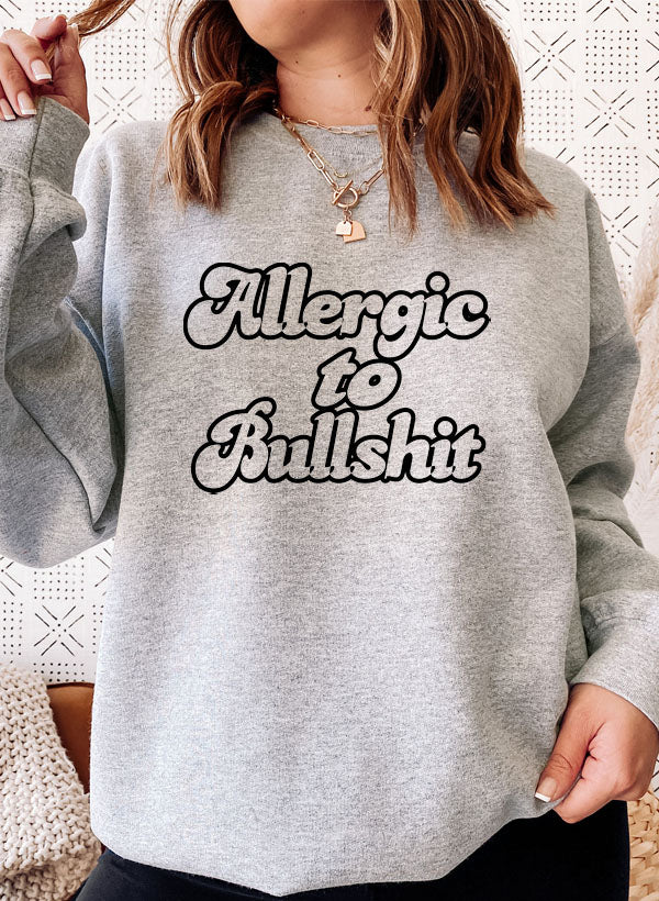 A cozy 'Allergic to Bullshit' Sweat Shirt featuring a unique design, made from soft cotton/poly fleece blend, perfect for casual wear.