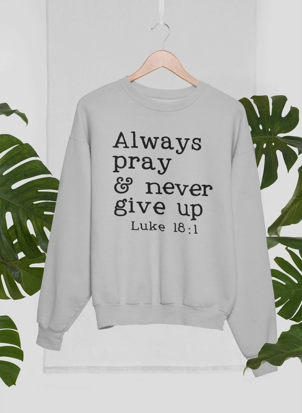 Always Pray & Never Give Up Sweat Shirt featuring a cozy fleece design and inspirational text.