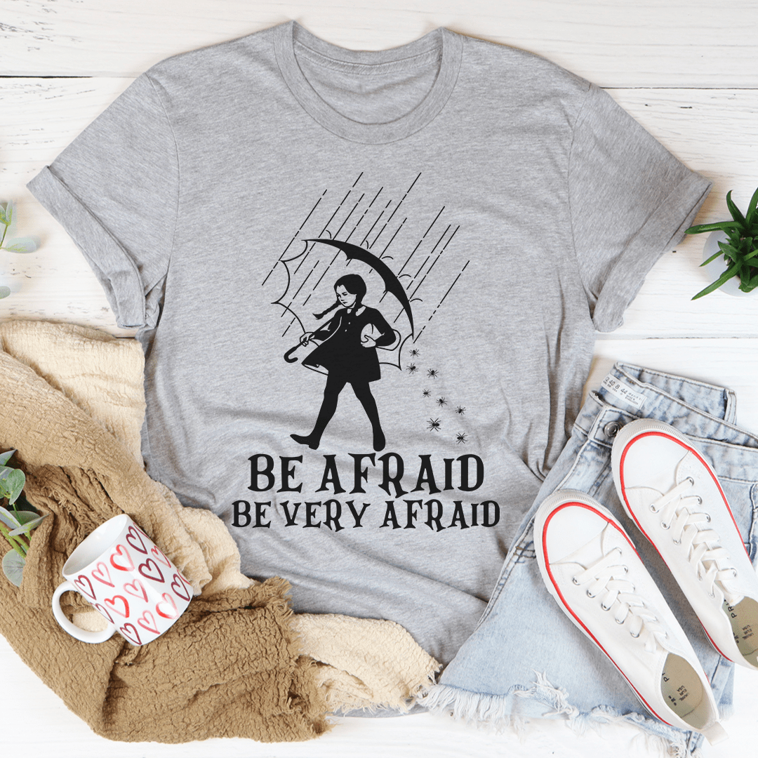 Be Afraid Be Very Afraid T-Shirt made of soft ring-spun cotton with double stitching, featuring a playful design.