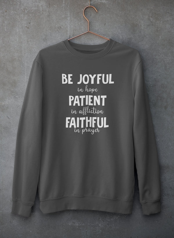 Be Joyful In Hope sweatshirt featuring inspirational text, cozy fleece material, and adjustable cuffs.