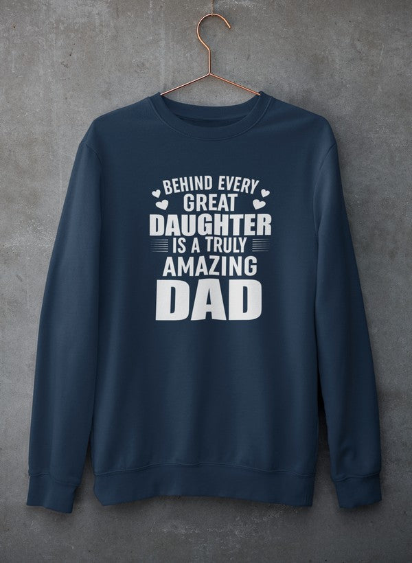 A cozy sweatshirt featuring the phrase 'Behind Every Great Daughter Is a Truly Amazing Dad', made from a soft cotton/poly fleece blend.