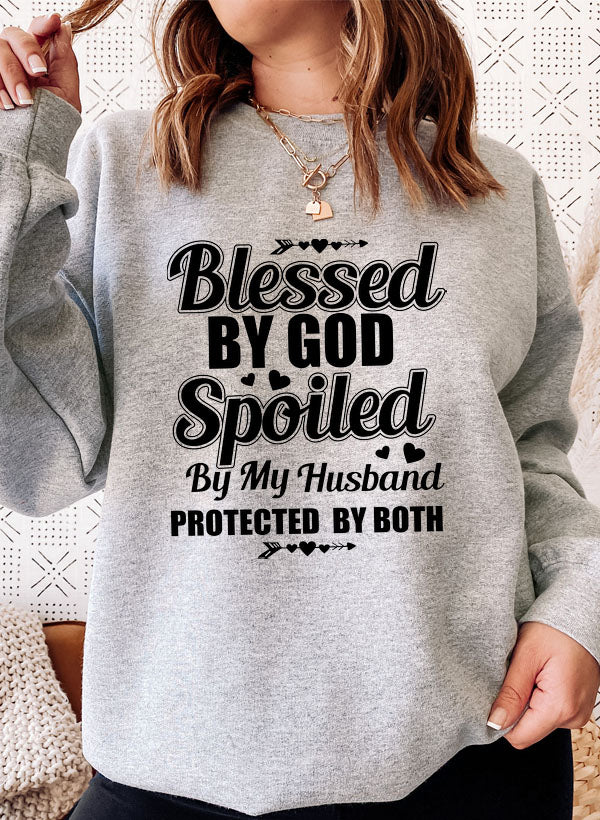 Cozy Blessed By God Spoiled By My Husband Sweat Shirt in a soft cotton/poly fleece blend, featuring adjustable banded cuffs for warmth.