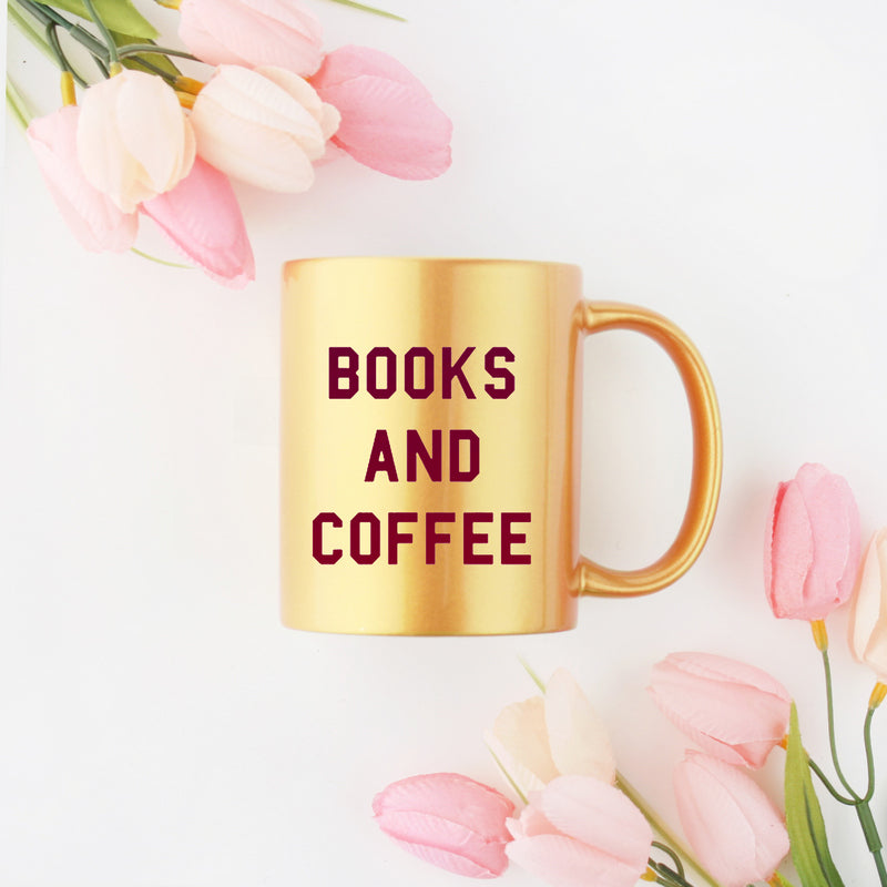 Elegant gold and silver ceramic mug with a unique design, perfect for coffee and book lovers.