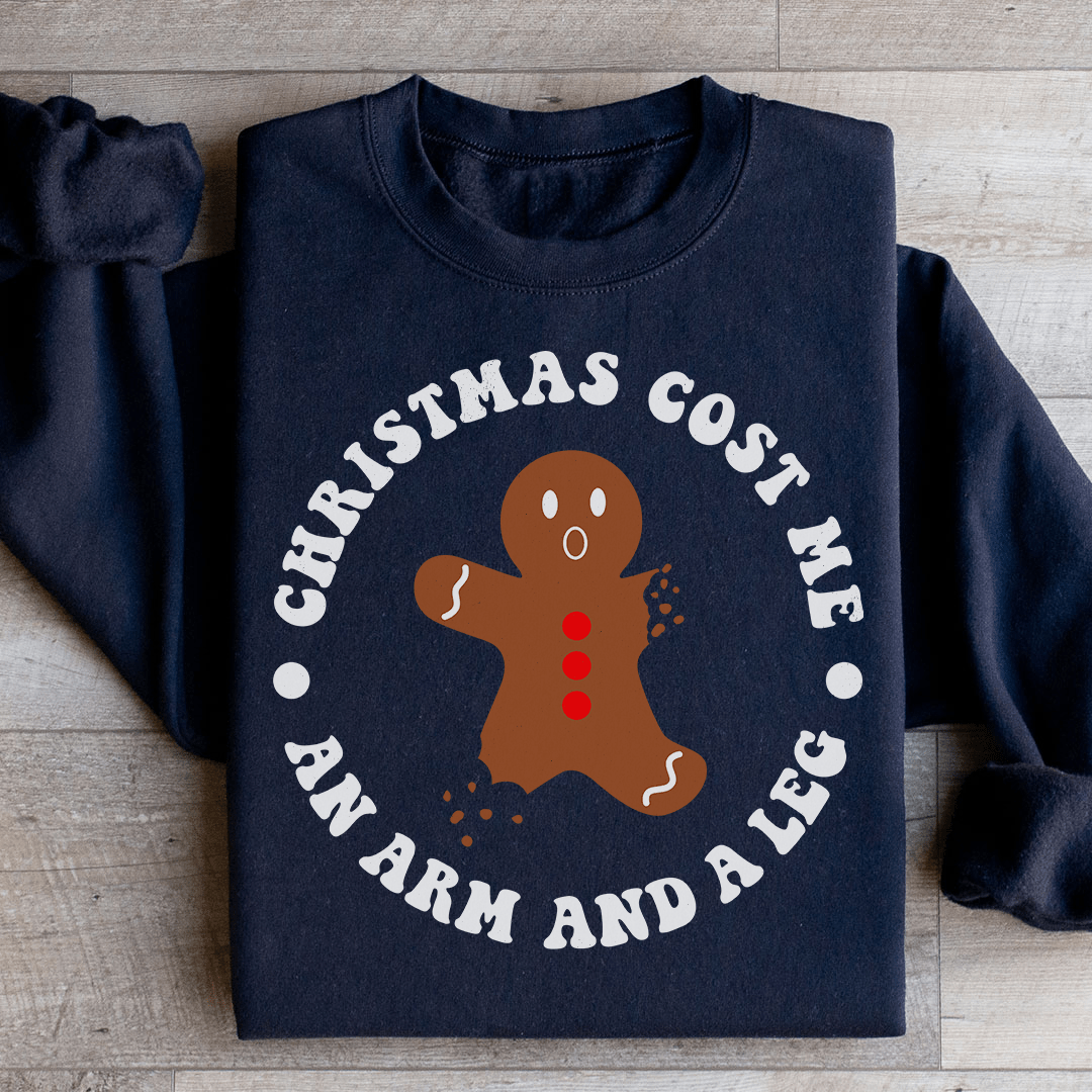 Cozy 'Christmas Cost Me An Arm And A Leg' sweatshirt featuring a unique holiday design, made from soft cotton/poly fleece blend.