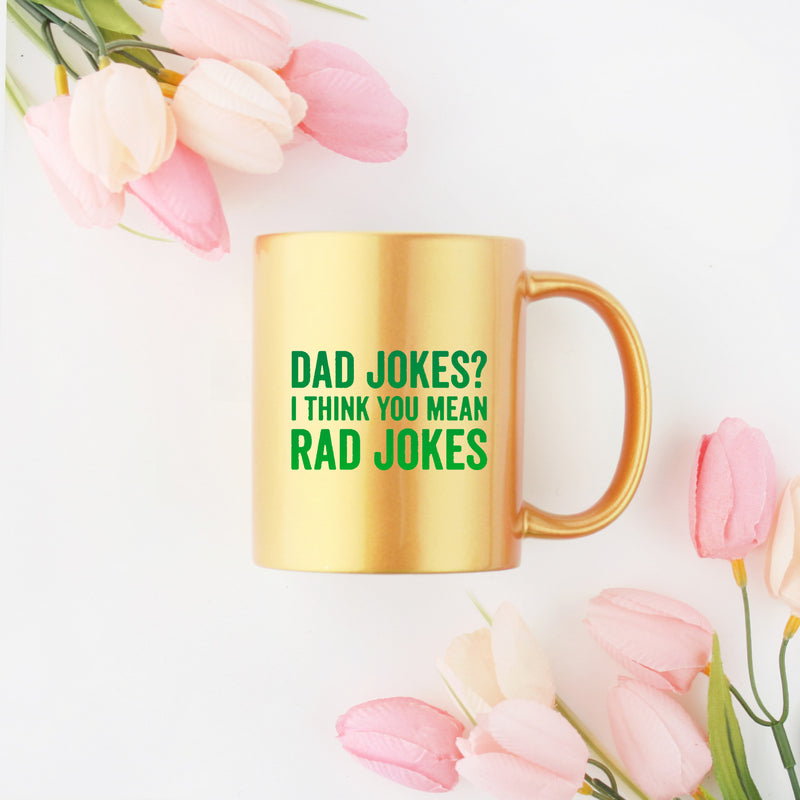 Ceramic mug featuring dad jokes design with gold metallic coating, perfect for coffee lovers.