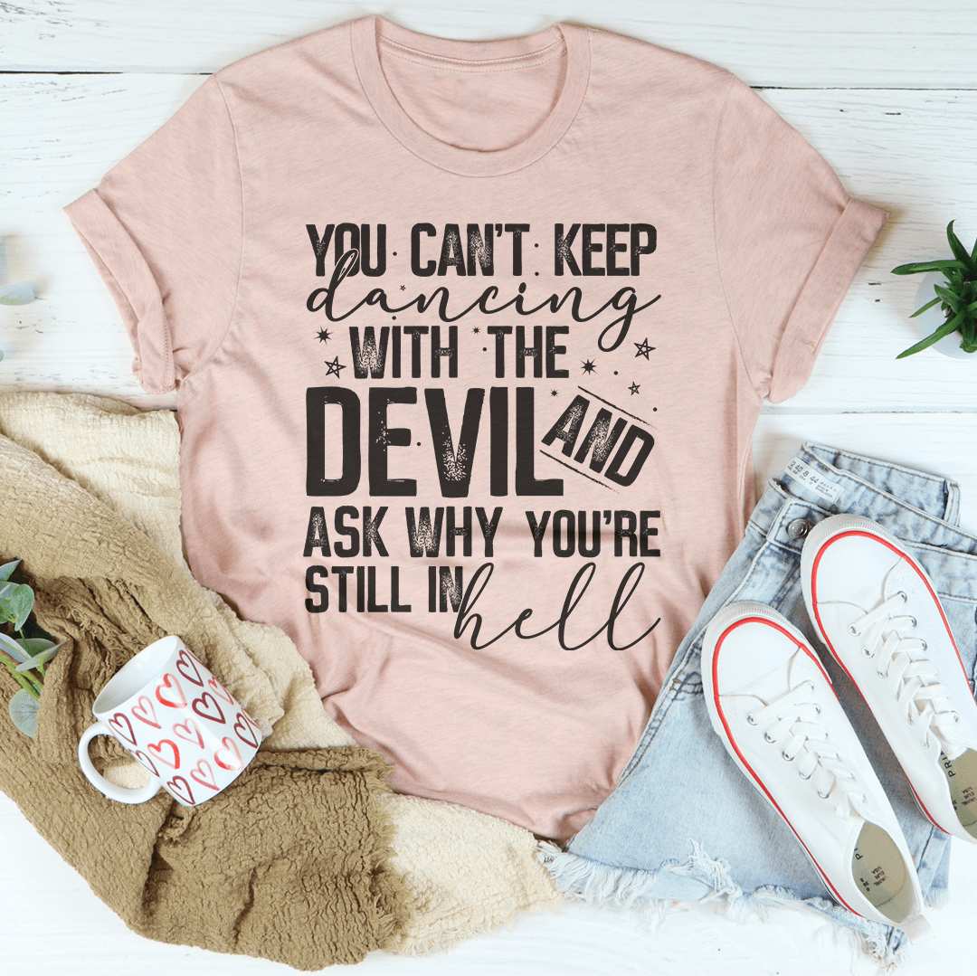 Dancing With The Devil T-Shirt featuring bold graphics on a soft cotton fabric, showcasing its durability and stylish design.
