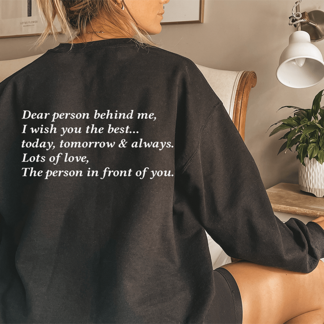 A cozy 'Dear Person Behind Me' hoodie featuring unique artistic designs, made from a soft cotton/poly fleece blend.