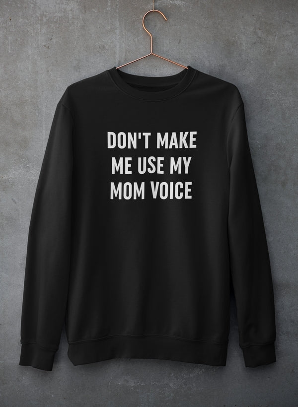 A cozy Don't Make Me Use My Mom Voice Sweat Shirt featuring a humorous design, made from a soft cotton/poly fleece blend.