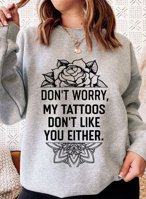 A cozy Don't Worry My Tattoos Don't Like You Either Sweat Shirt featuring a unique tattoo-themed design, perfect for casual wear.
