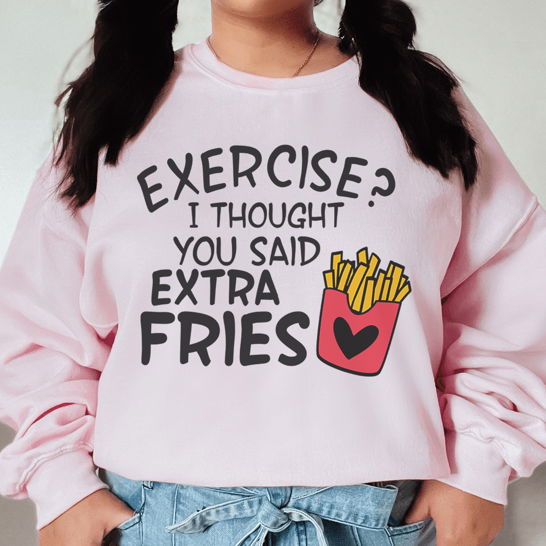 A stylish hoodie featuring the phrase 'Exercise I Thought You Said Extra Fries', designed by top artists, showcasing a cozy fleece lining.
