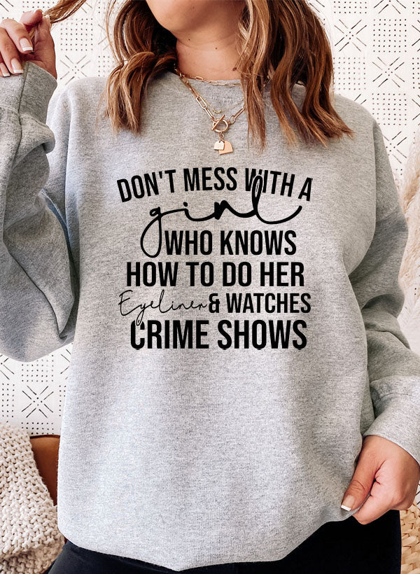 Eyeliner & Crime Shows Sweat Shirt featuring a stylish design, made from soft cotton/poly fleece blend, perfect for crime show enthusiasts.