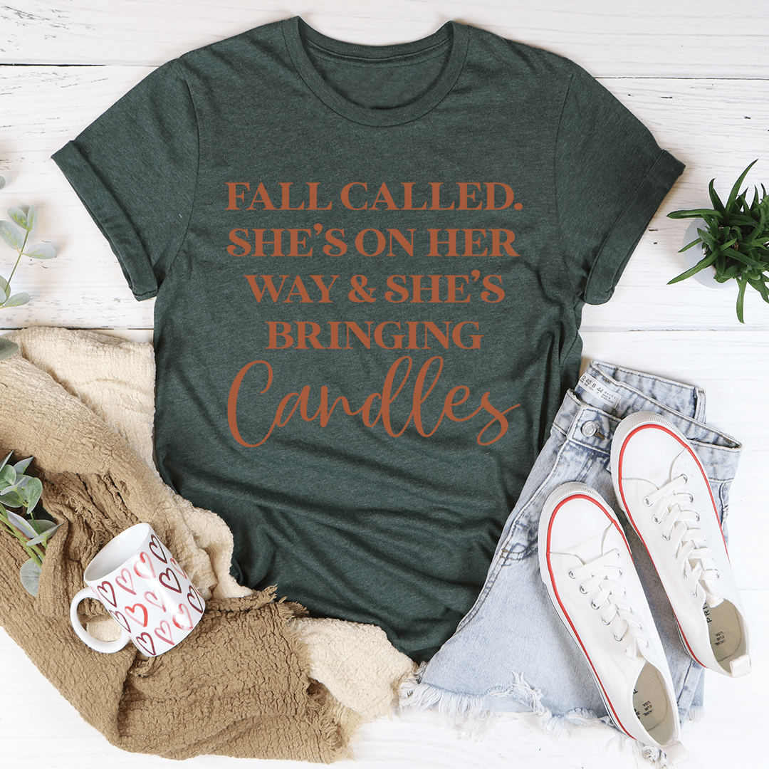 A cozy Fall Called She's On Her Way Candles Tee made of soft ring-spun cotton, featuring a whimsical candle design, perfect for autumn fashion.