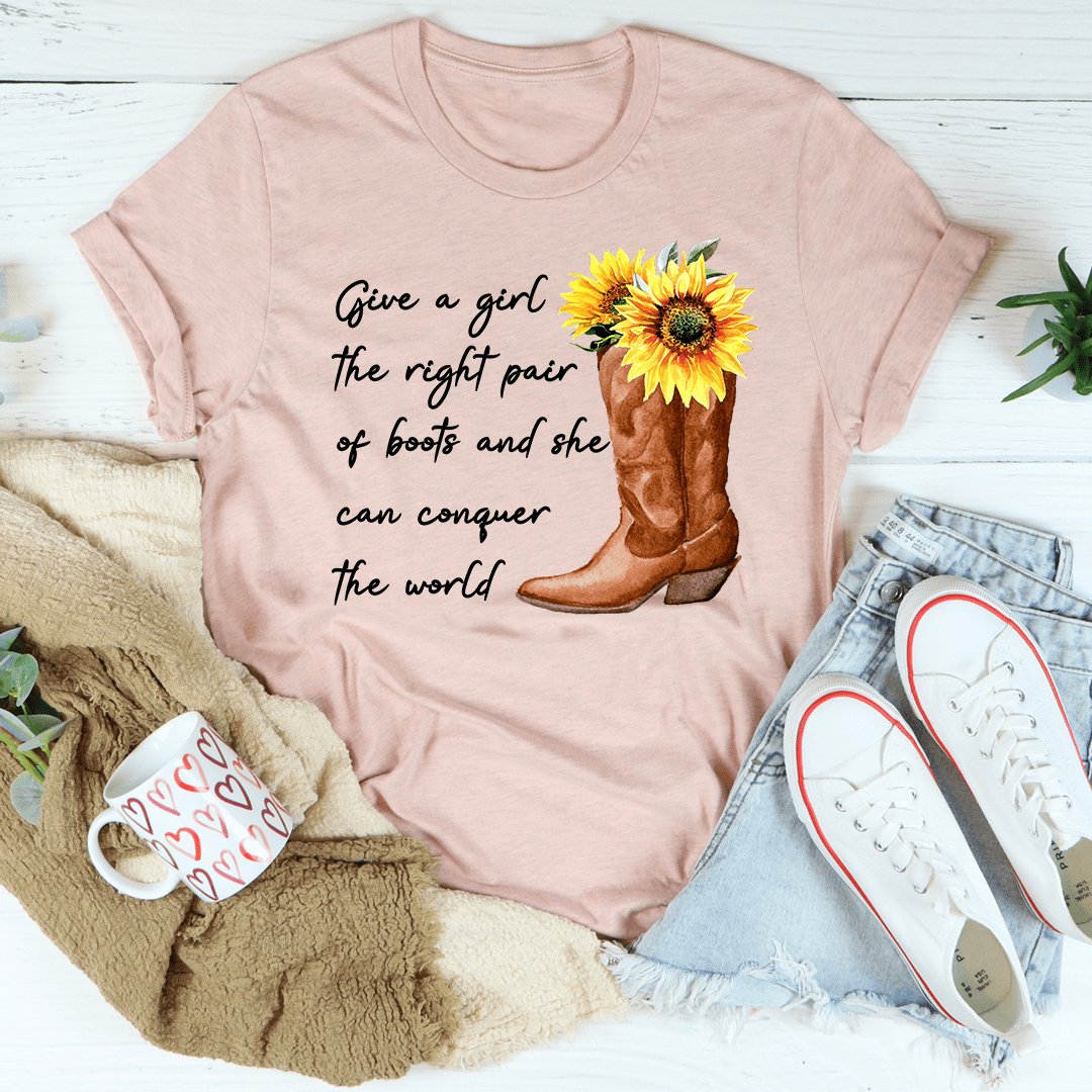 A stylish t-shirt featuring the phrase 'Give A Girl The Right Pair Of Boots', made from soft ring-spun cotton with double stitching.