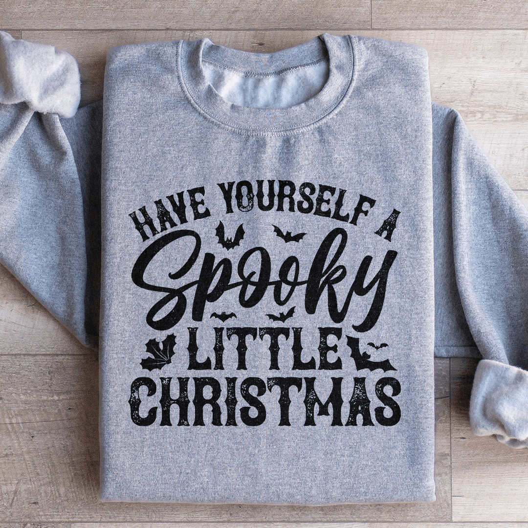 Cozy 'Have Yourself A Spooky Little Christmas' sweats featuring a unique spooky design, perfect for the holiday season.