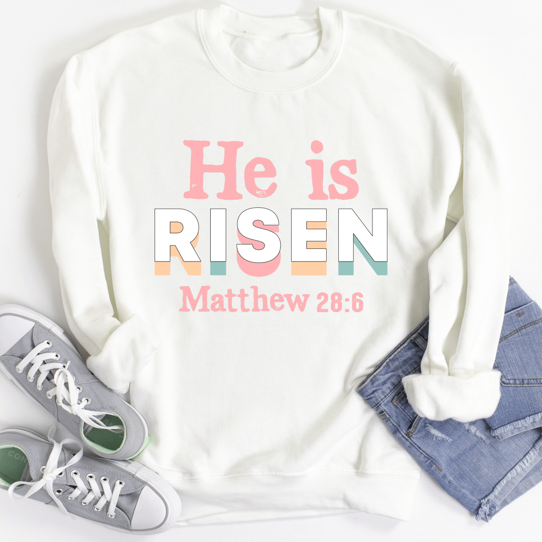 He Is Risen hoodie featuring a unique design, made from a warm cotton/poly fleece blend with adjustable cuffs.