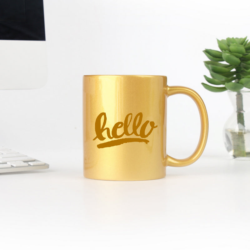 Hello Hand Lettering Yellow Gold & Silver Mug with elegant design and gold metallic coating, perfect for stylish sipping.