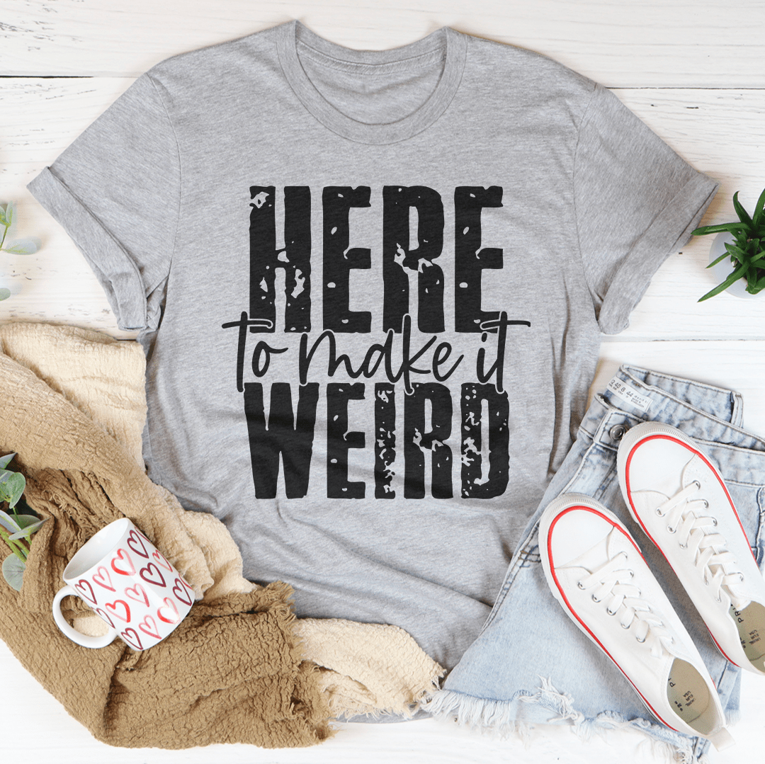 Here To Make It Weird Tee in various colors, showcasing its soft cotton fabric and durable stitching.