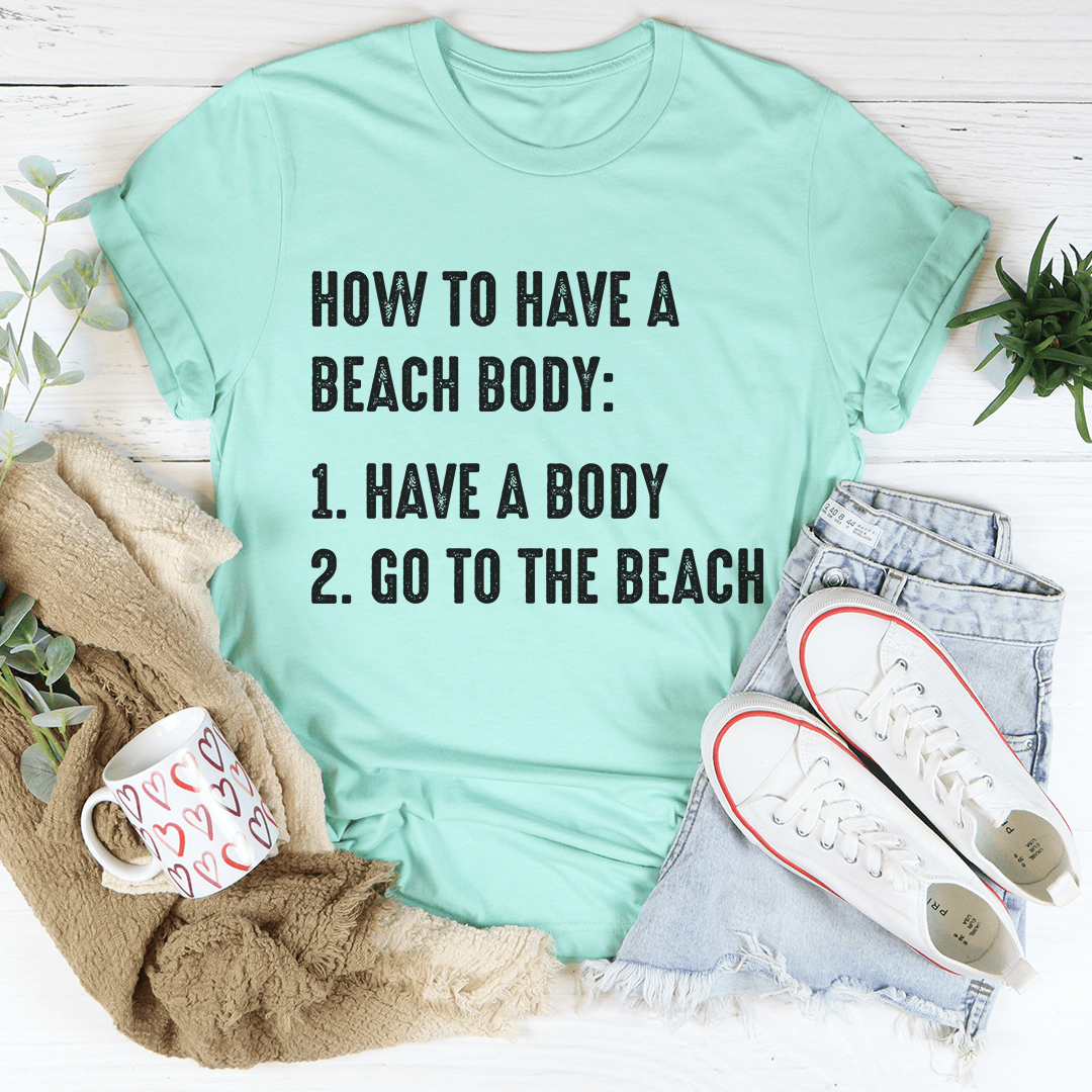 A stylish How to Have A Beach Body T-Shirt made from soft ring-spun cotton, featuring double stitching for durability, available in various sizes.