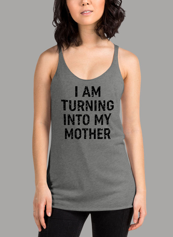 Black women's tank top with racer back style and curved hem, featuring the phrase 'I Am Turning Into My Mother'.
