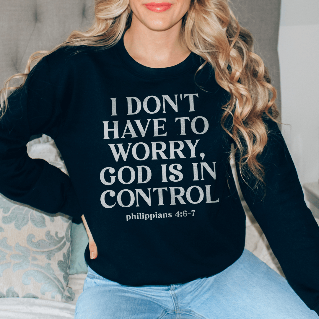 Cozy hoodie featuring the phrase 'I Don't Have To Worry God Is In Control', designed for comfort and style.