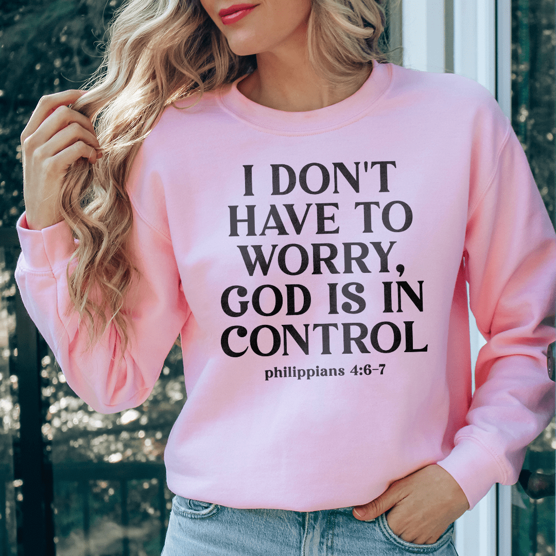 Cozy hoodie featuring the phrase 'I Don't Have To Worry God Is In Control', designed for comfort and style.
