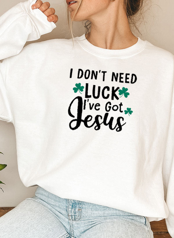 A cozy sweatshirt featuring the phrase 'I Don't Need Luck I've Got Jesus' in stylish lettering, perfect for expressing faith.