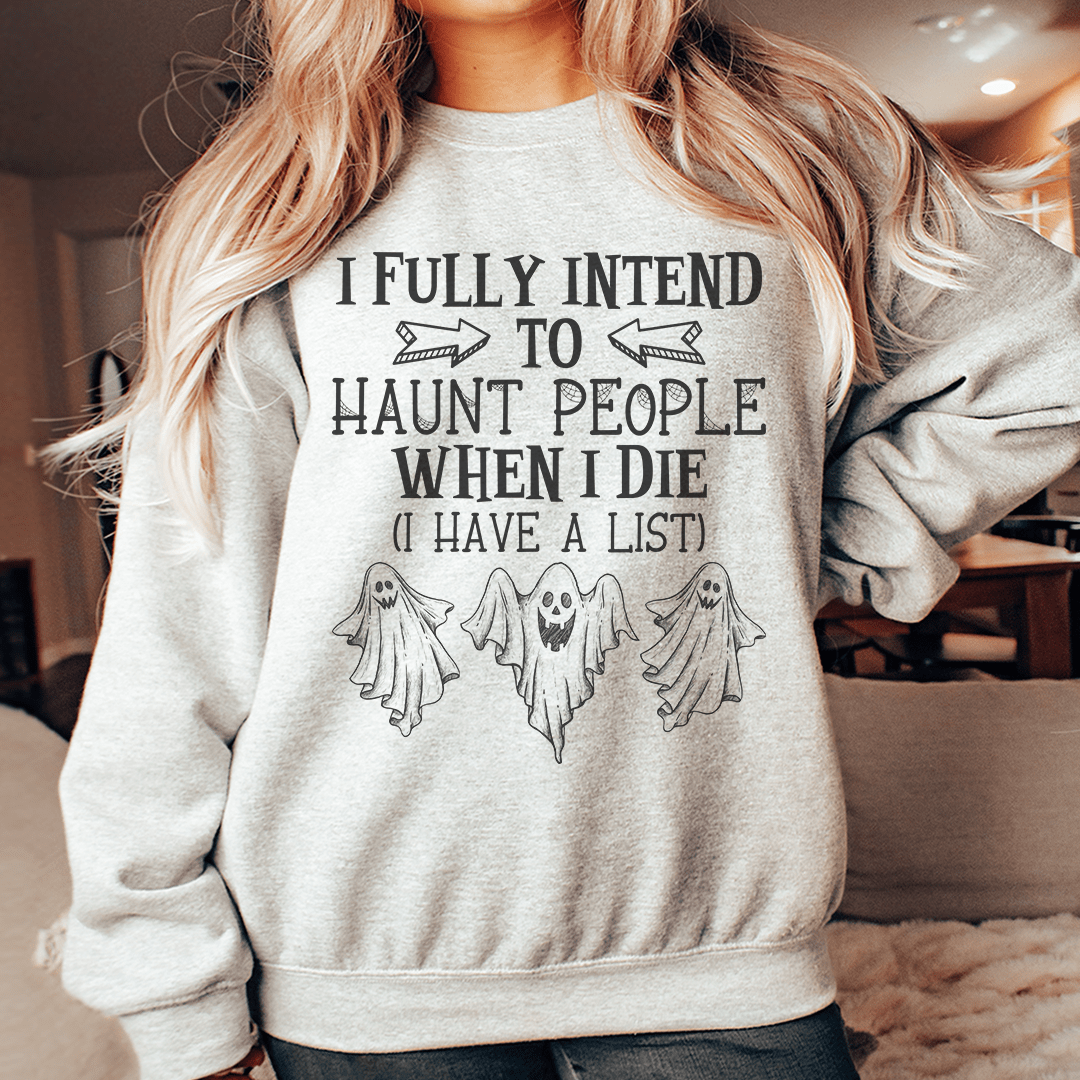 Cozy hoodie featuring the phrase 'I Fully Intend To Haunt People When I Die', made from a soft cotton/poly fleece blend.