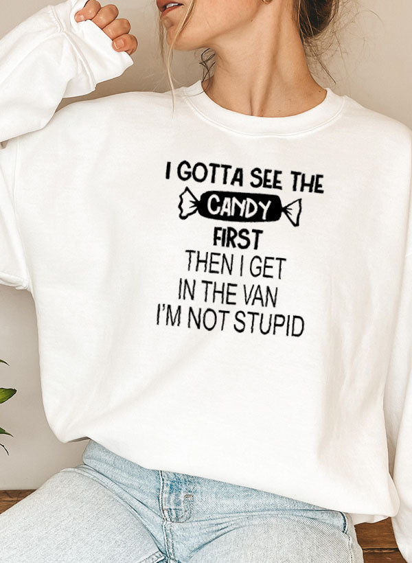 I Gotta See The Candy First Sweat Shirt featuring a colorful design by top artists, made from soft cotton/poly fleece blend.