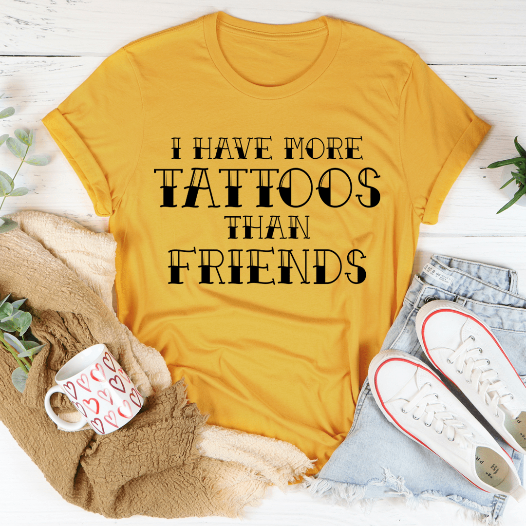 I Have More Tattoos Than Friends T-Shirt displayed on a mannequin, showcasing its soft cotton fabric and double stitching.