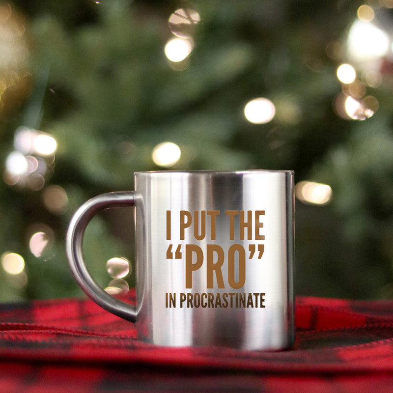 Ceramic gold and silver mug with 'I Put The Pro In Procrastinate' design, perfect for coffee or tea.